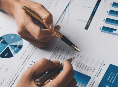 People reviewing a cost of doing business report