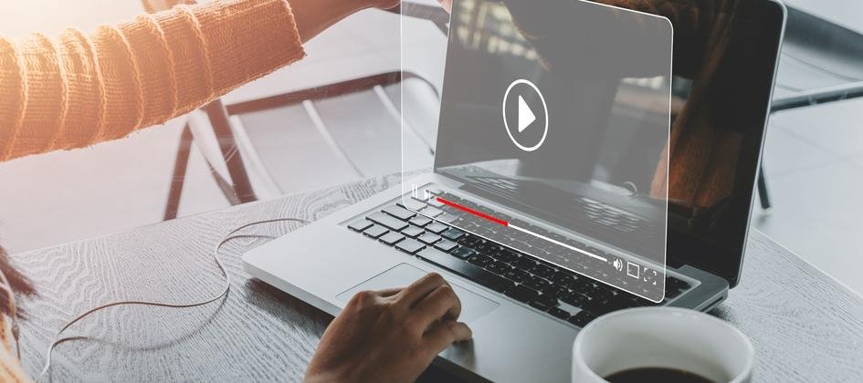 Person watching an educational podcast video on a laptop, showcasing modern member engagement strategies for associations